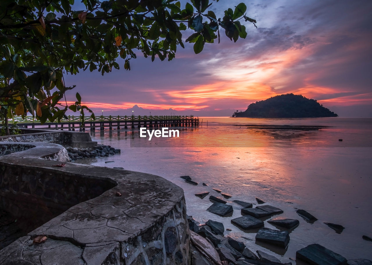 Scenic view of sea against sky at sunset