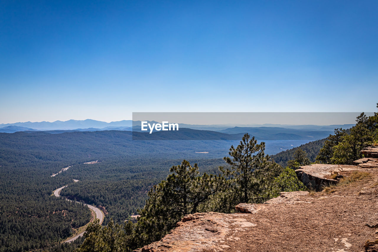 SCENIC VIEW OF LANDSCAPE AGAINST BLUE SKY