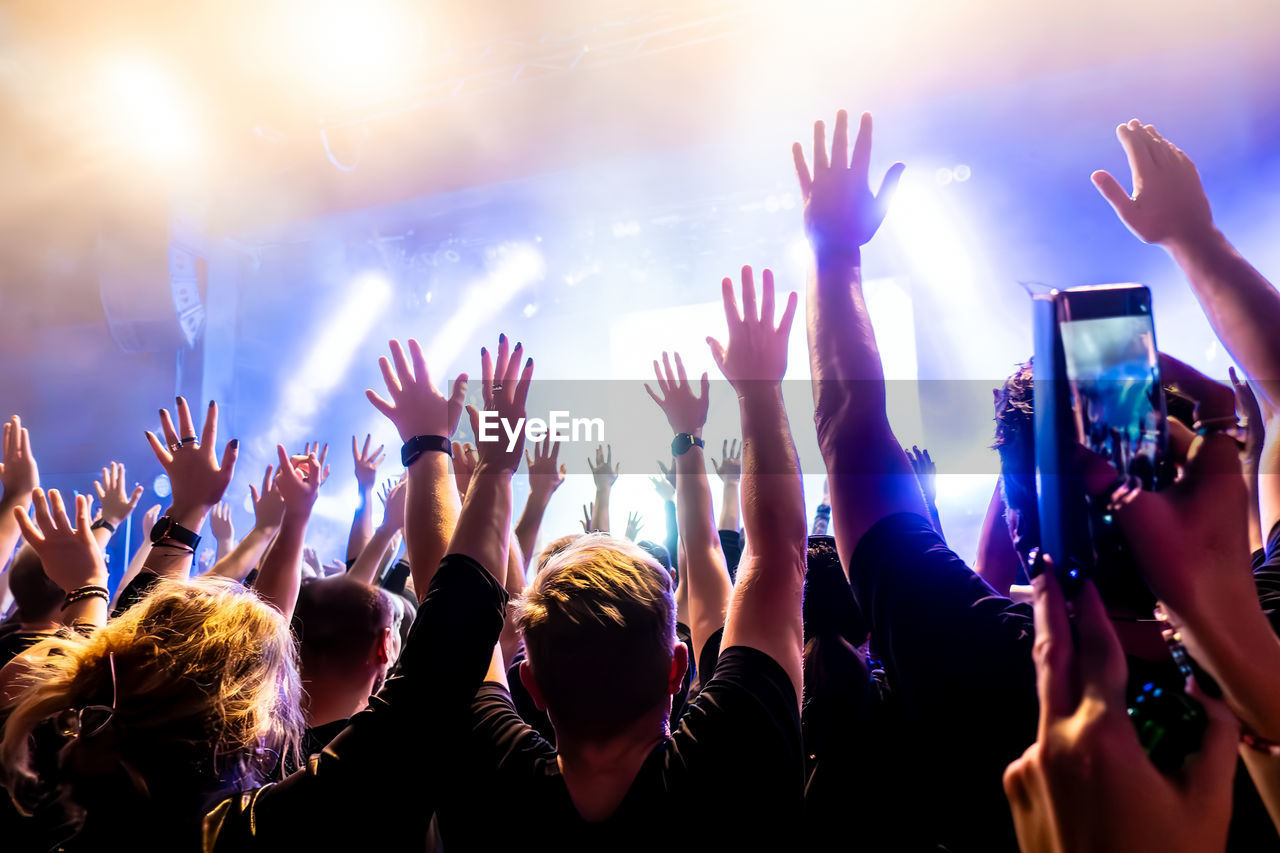 Cheering concert crowd at a rock concert