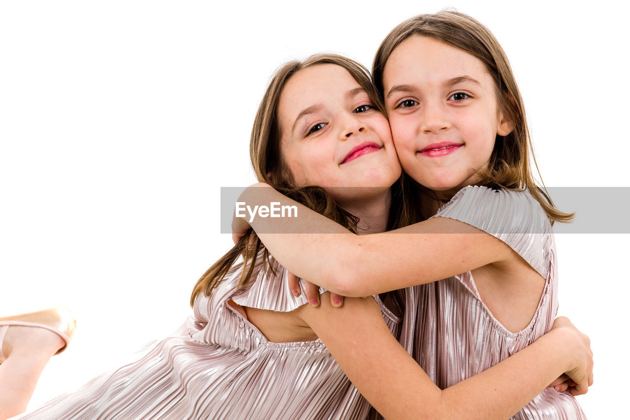 PORTRAIT OF A SMILING GIRL WITH WHITE BACKGROUND