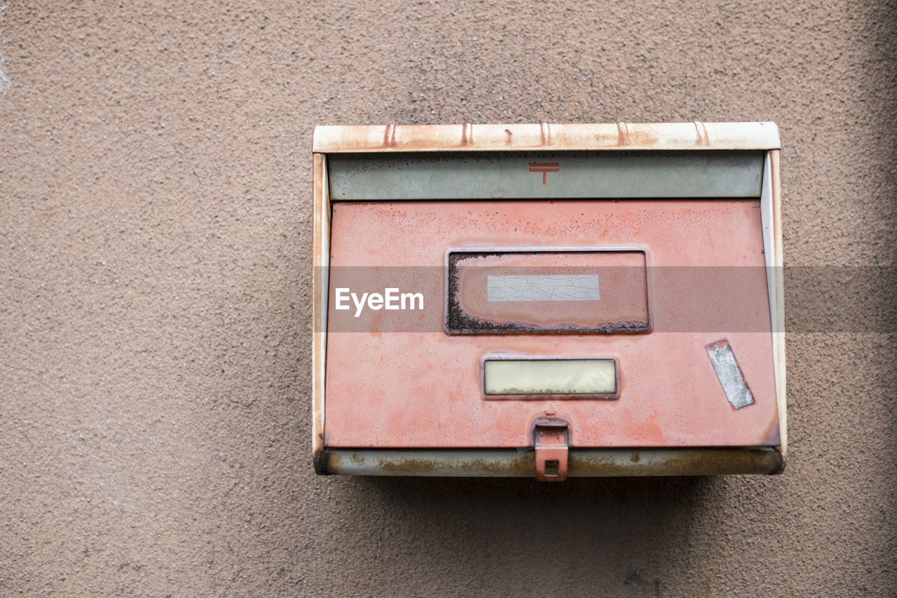 Close-up of mailbox on wall