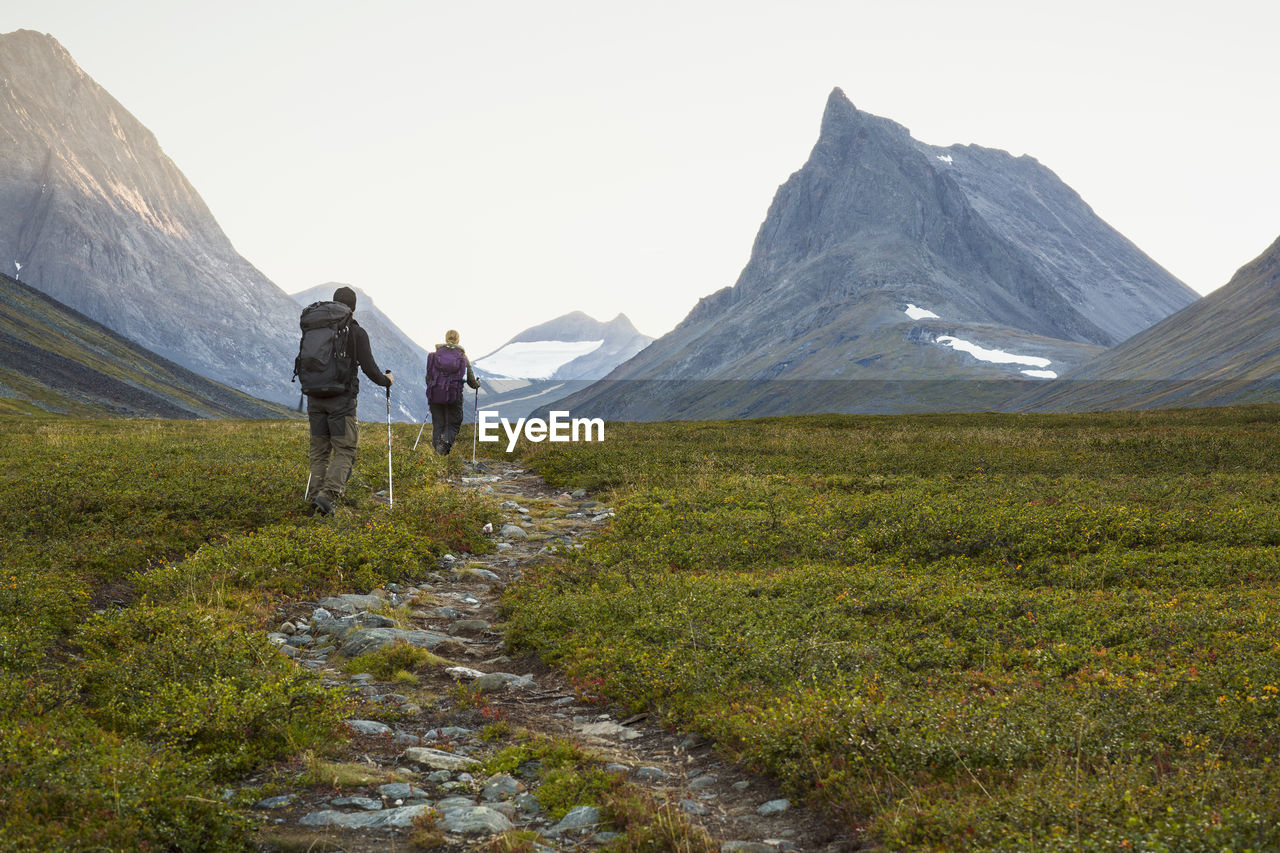 A man and a woman hiking