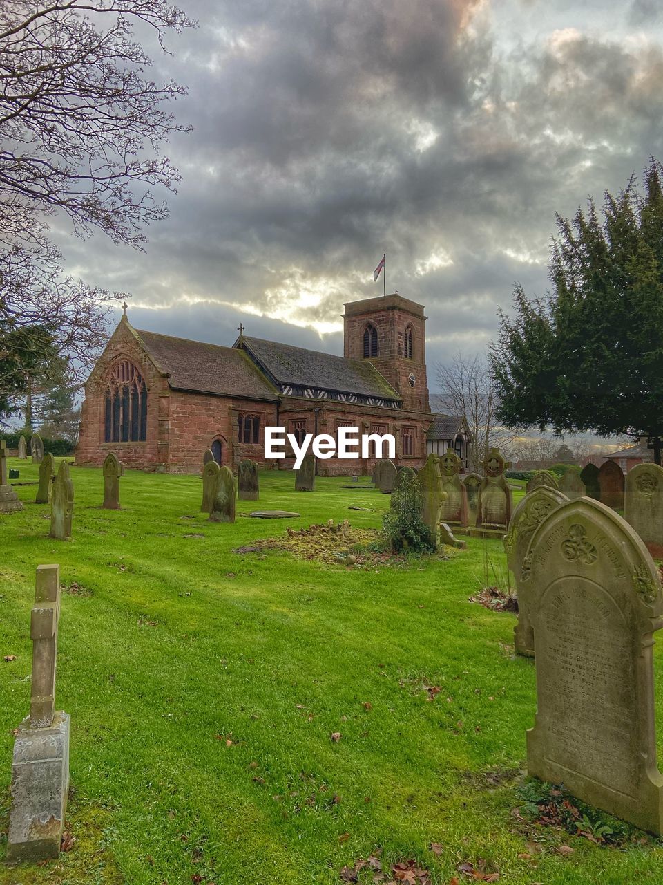 VIEW OF CEMETERY AGAINST BUILDINGS