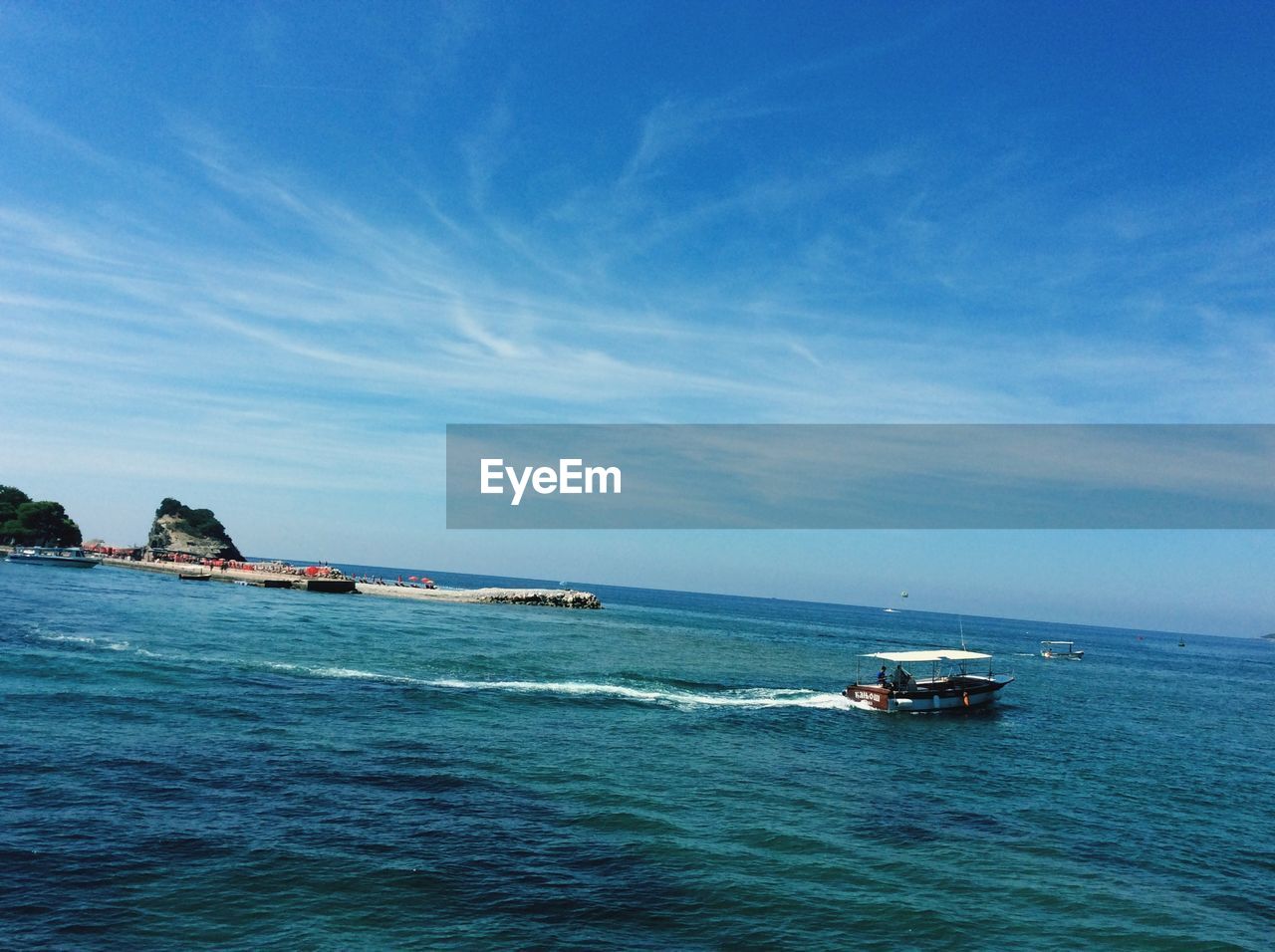 VIEW OF BOATS IN SEA