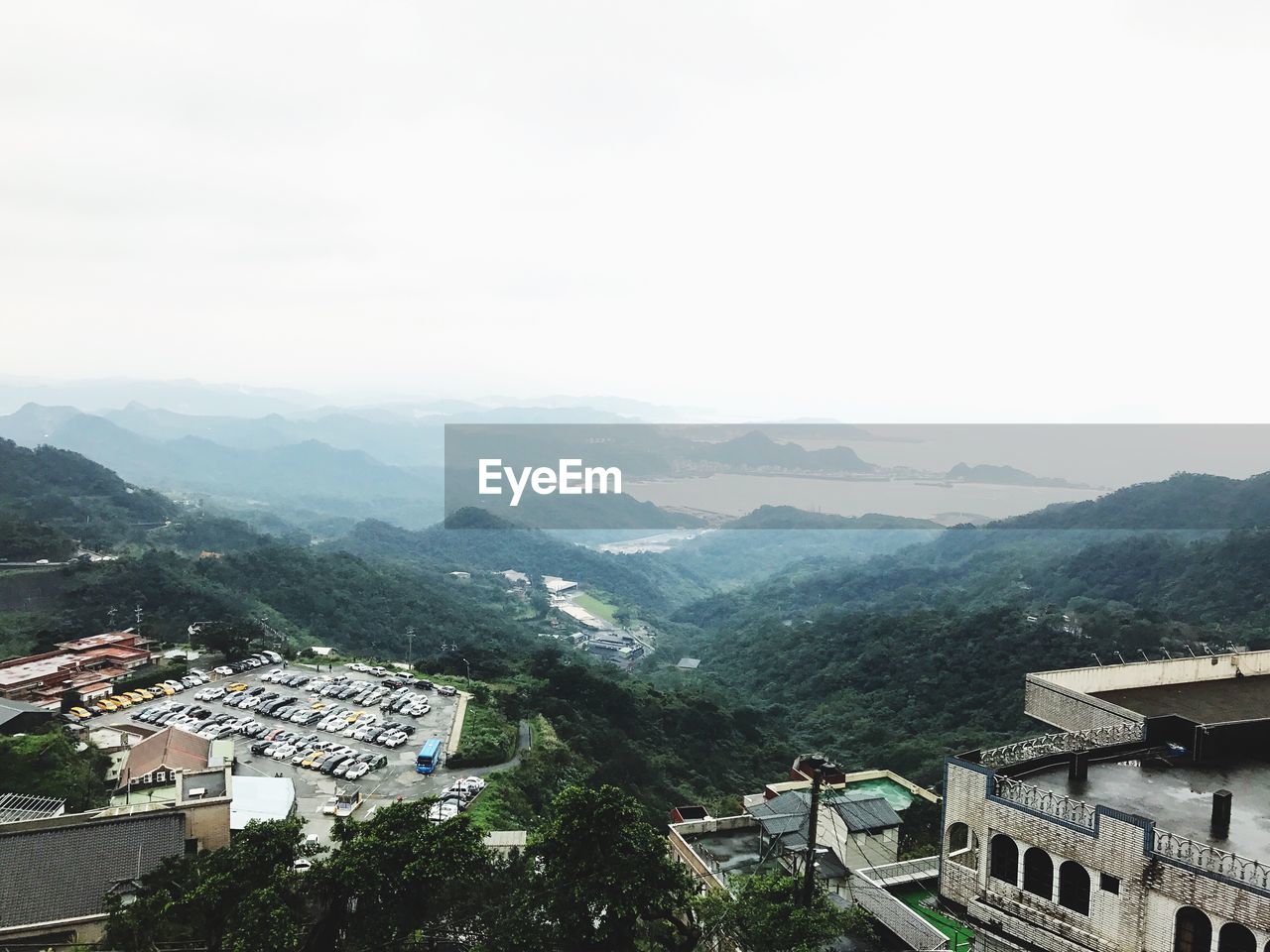 High angle view of houses and mountains against clear sky