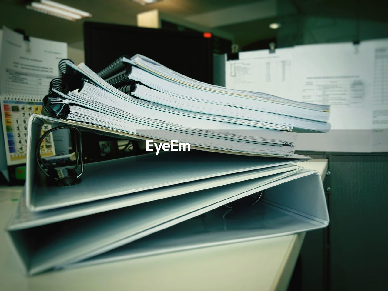 Stack of files on table at office