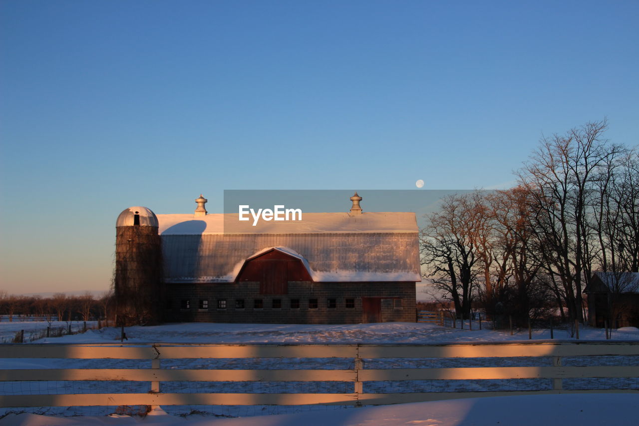 BUILT STRUCTURE IN WINTER AGAINST CLEAR SKY