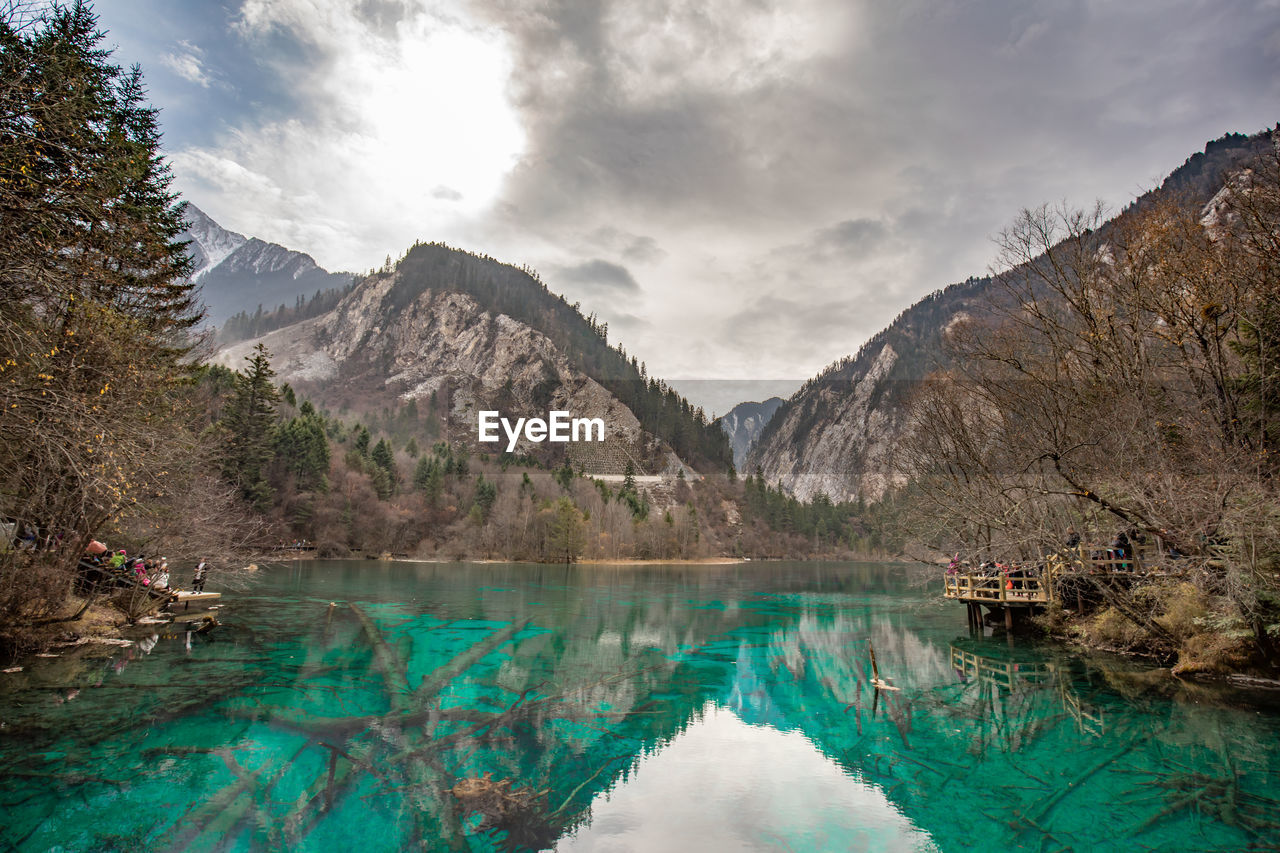 Scenic view of lake and mountains against sky