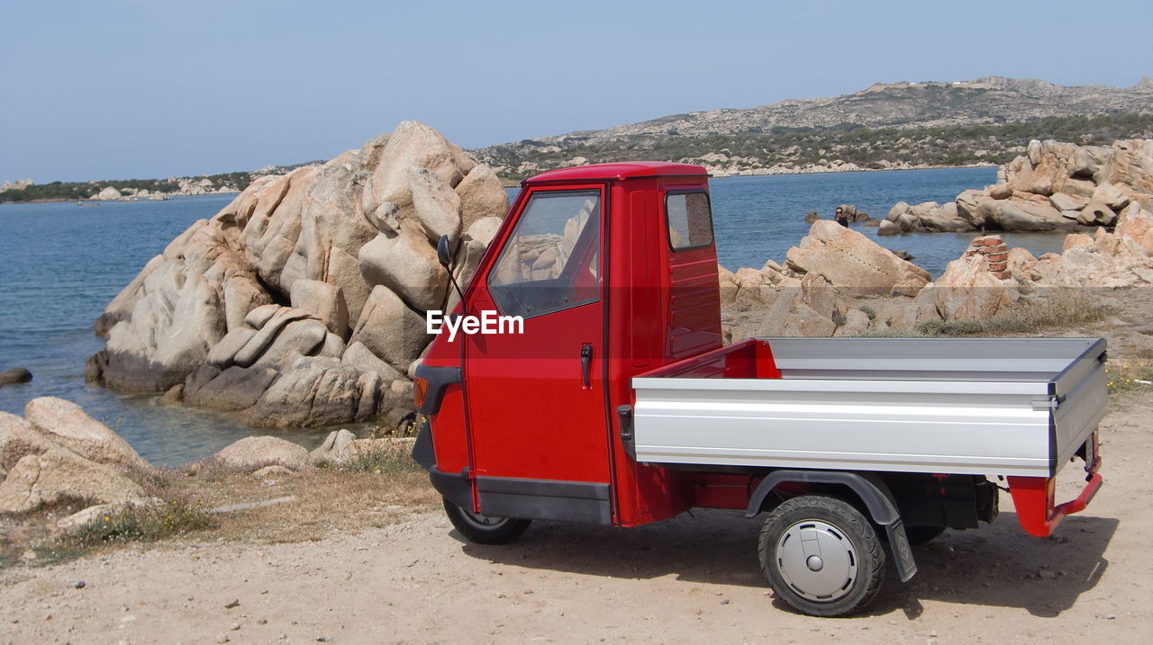 VINTAGE CAR ON BEACH