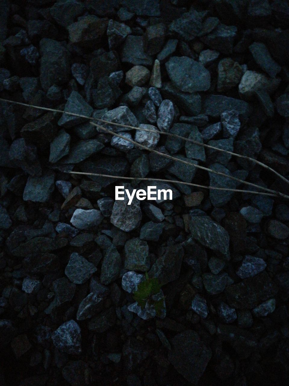 HIGH ANGLE VIEW OF STONES ON STONE