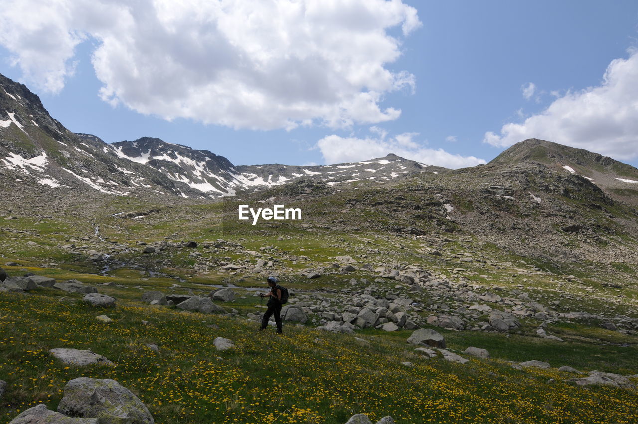 Full length of man on mountain against sky