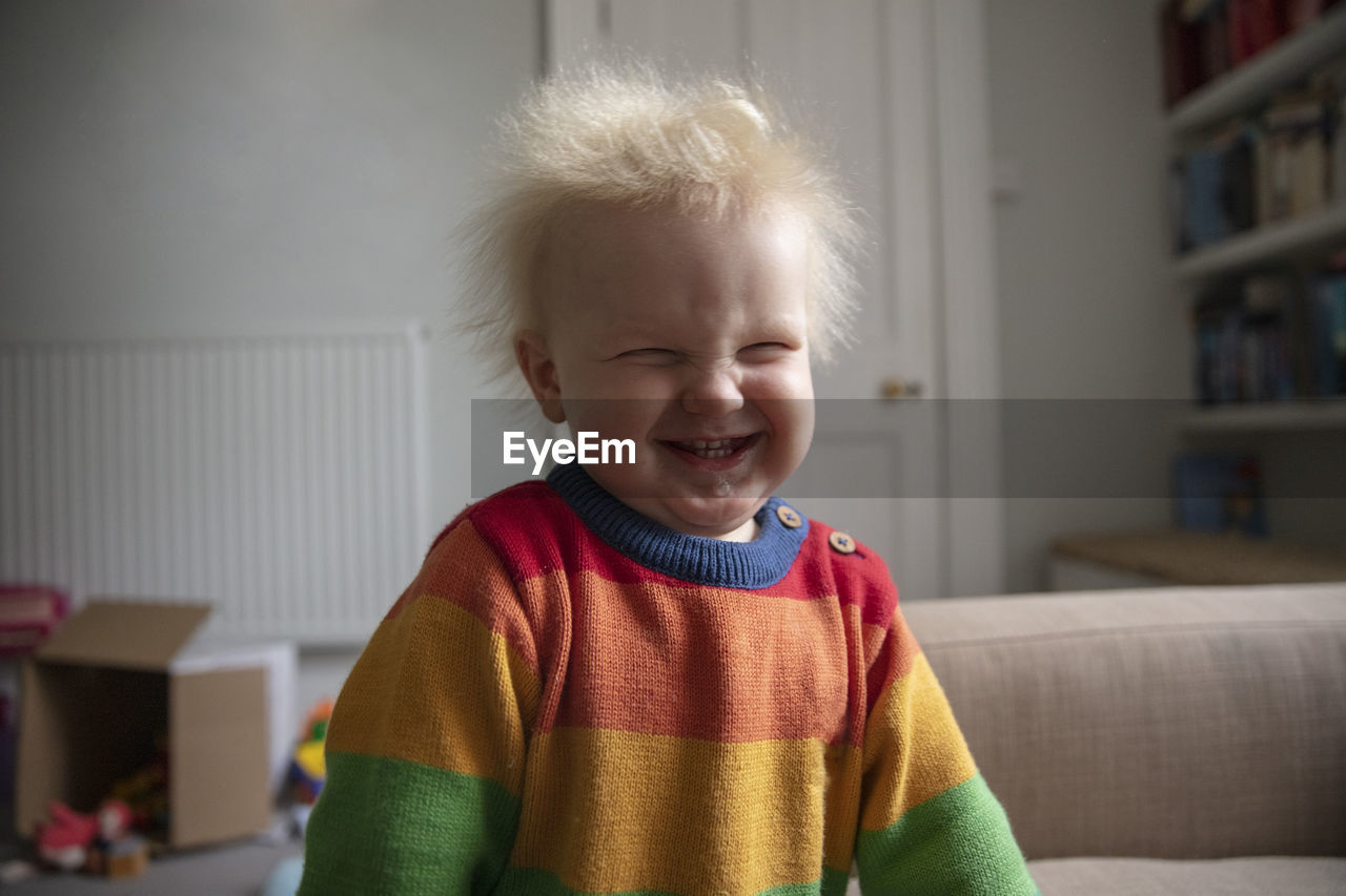 Portrait of smiling boy at home