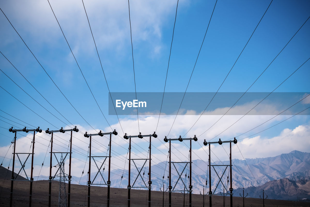 LOW ANGLE VIEW OF ELECTRICITY PYLON AGAINST SKY