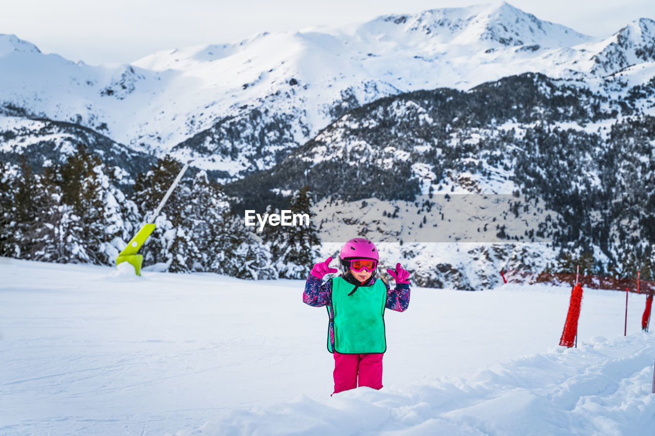 Young skier, girl having fun on the snow. winter ski holidays in andorra