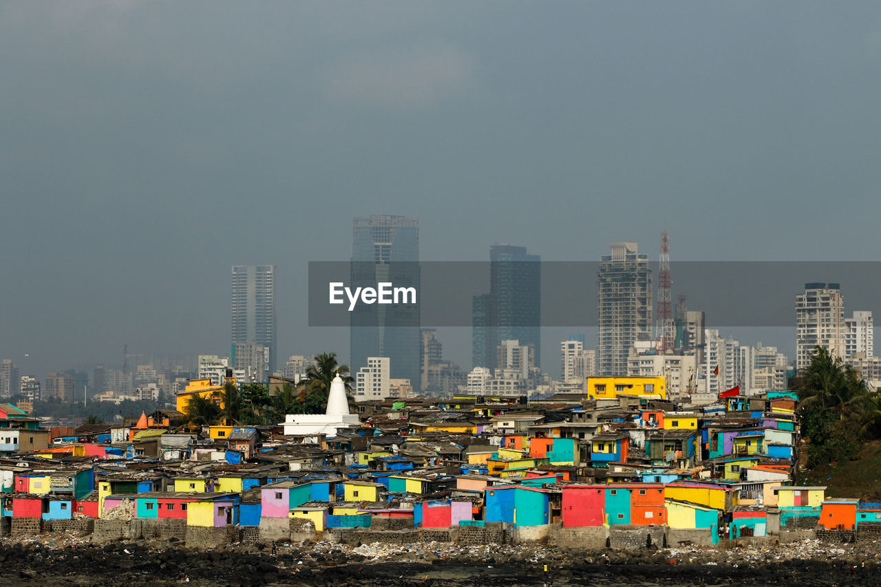 Panoramic shot of buildings against sky in city