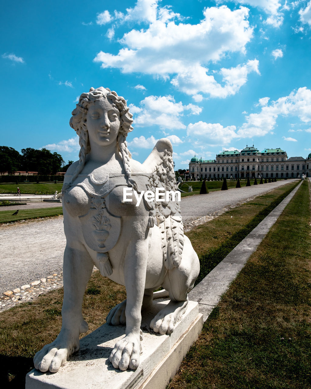 Statue in park against sky