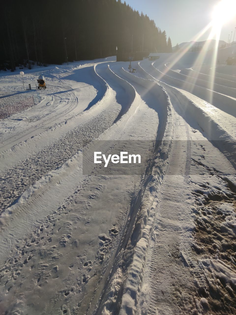 Tire tracks on snow covered land