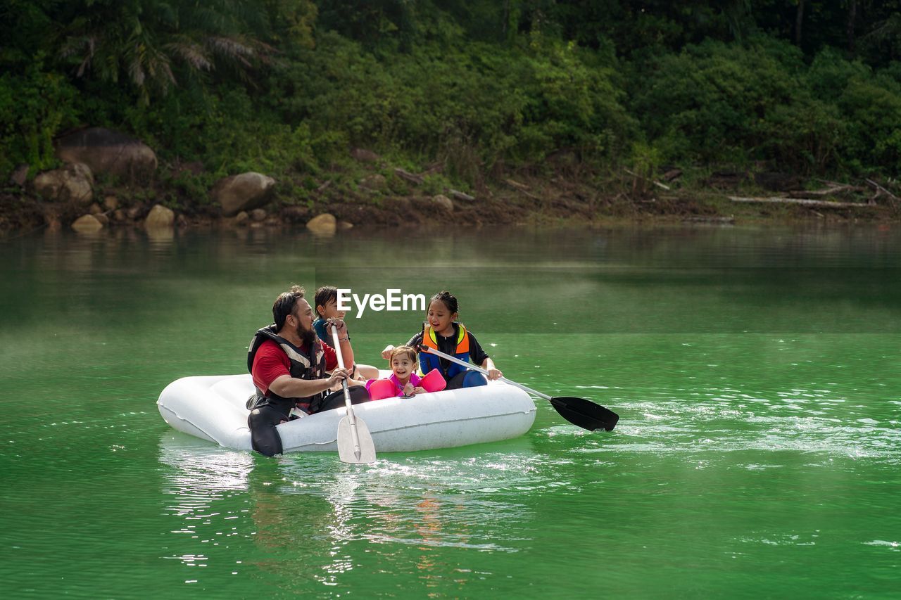 People on boat in lake