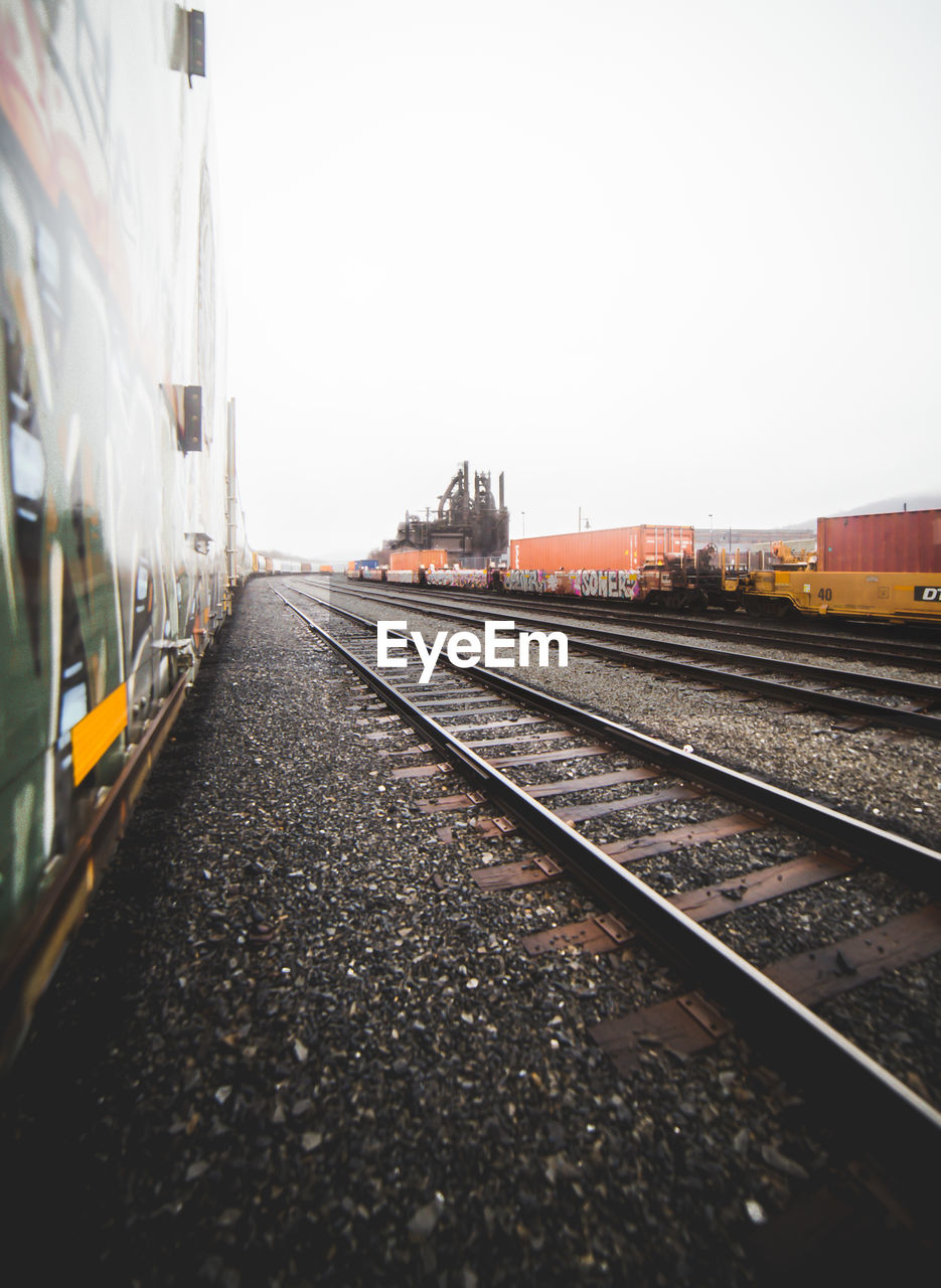 Train on railroad tracks against sky