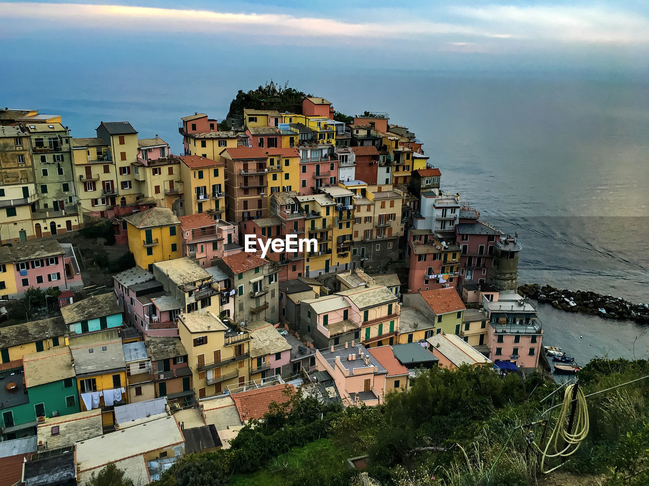 High angle view of buildings by river at cinque terre