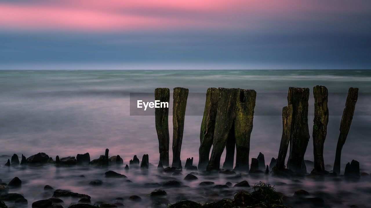 scenic view of sea against sky at sunset