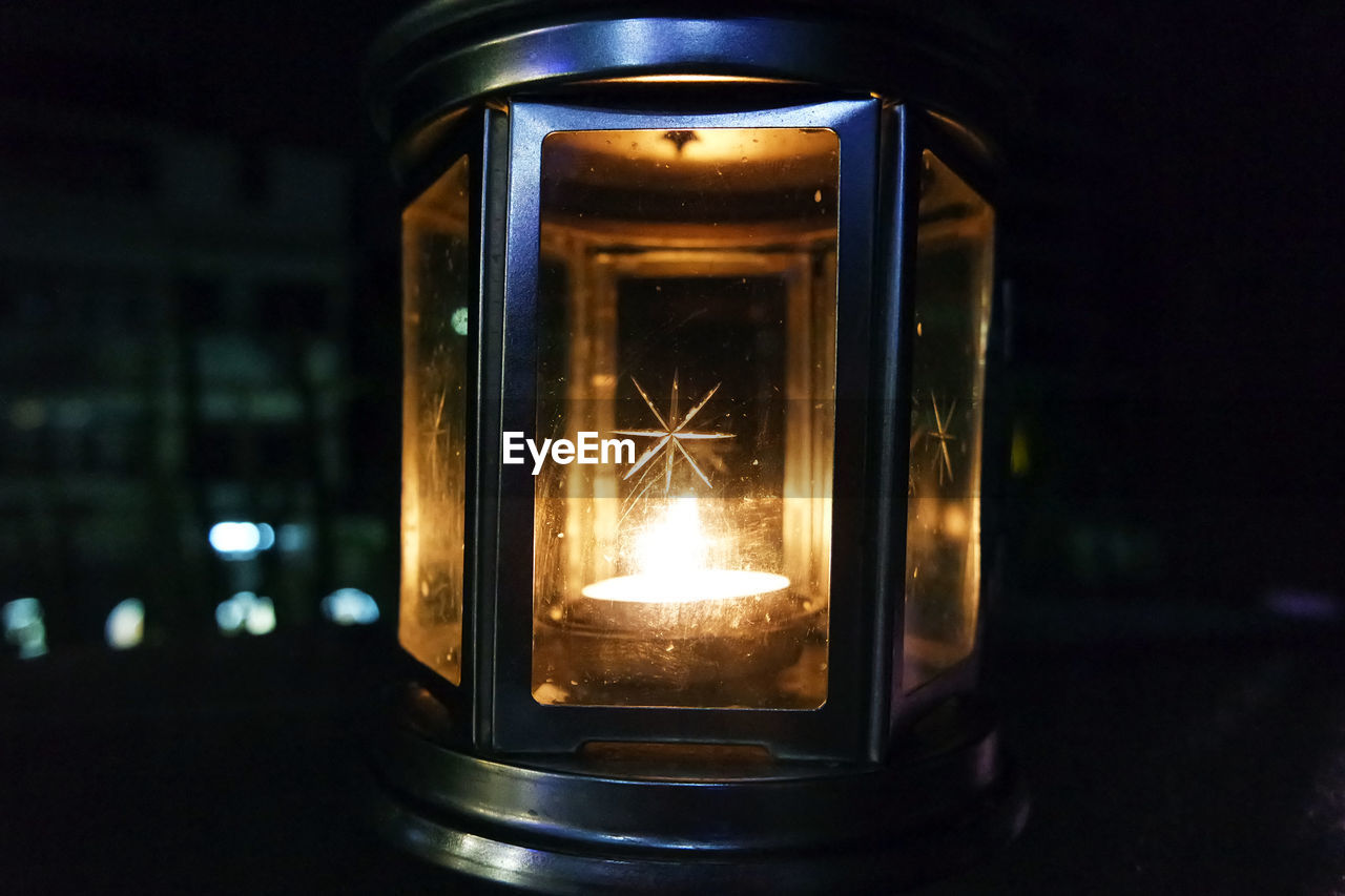 Close-up of illuminated lantern in dark