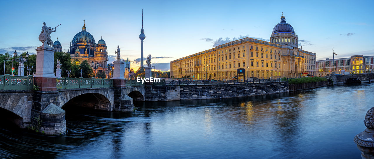 Panorama of the berlin cathedral, the tv tower and the reconstructed city palace before sunrise