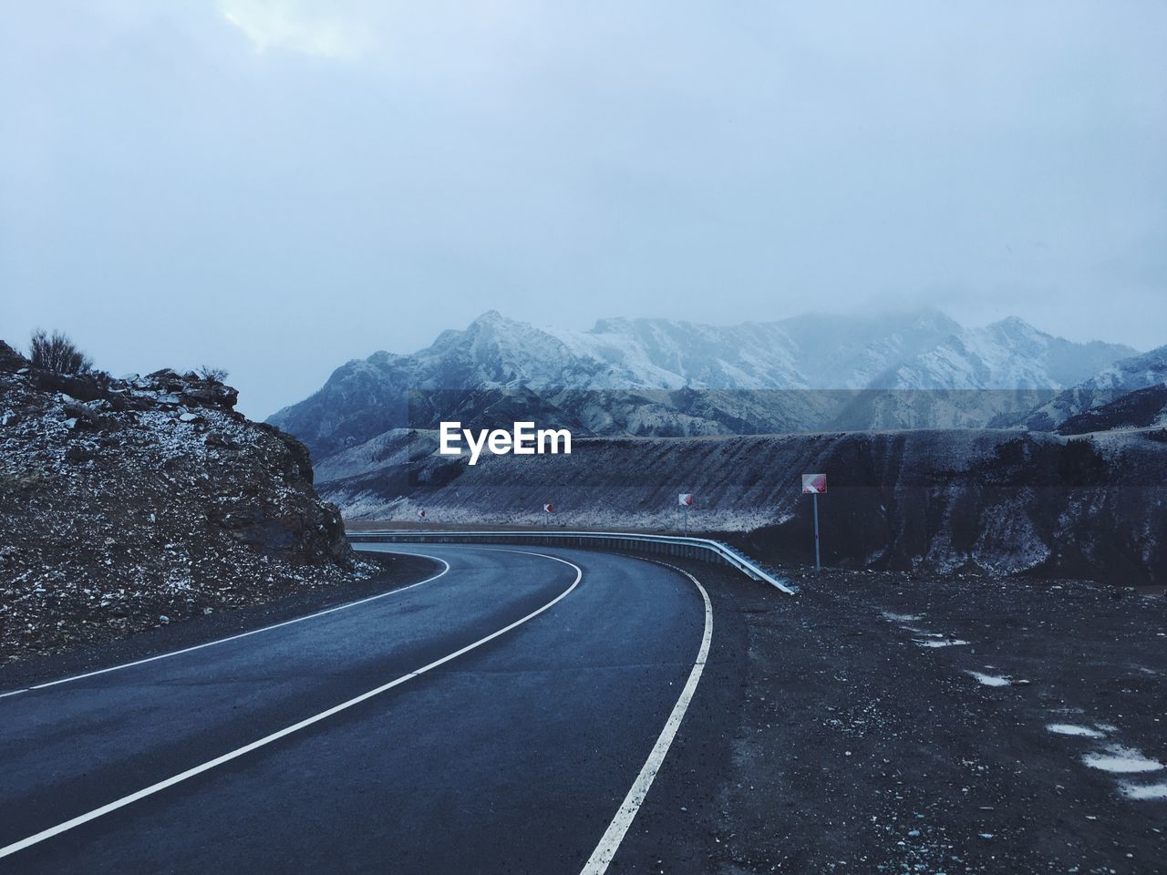 Empty road along mountain range against sky. altai