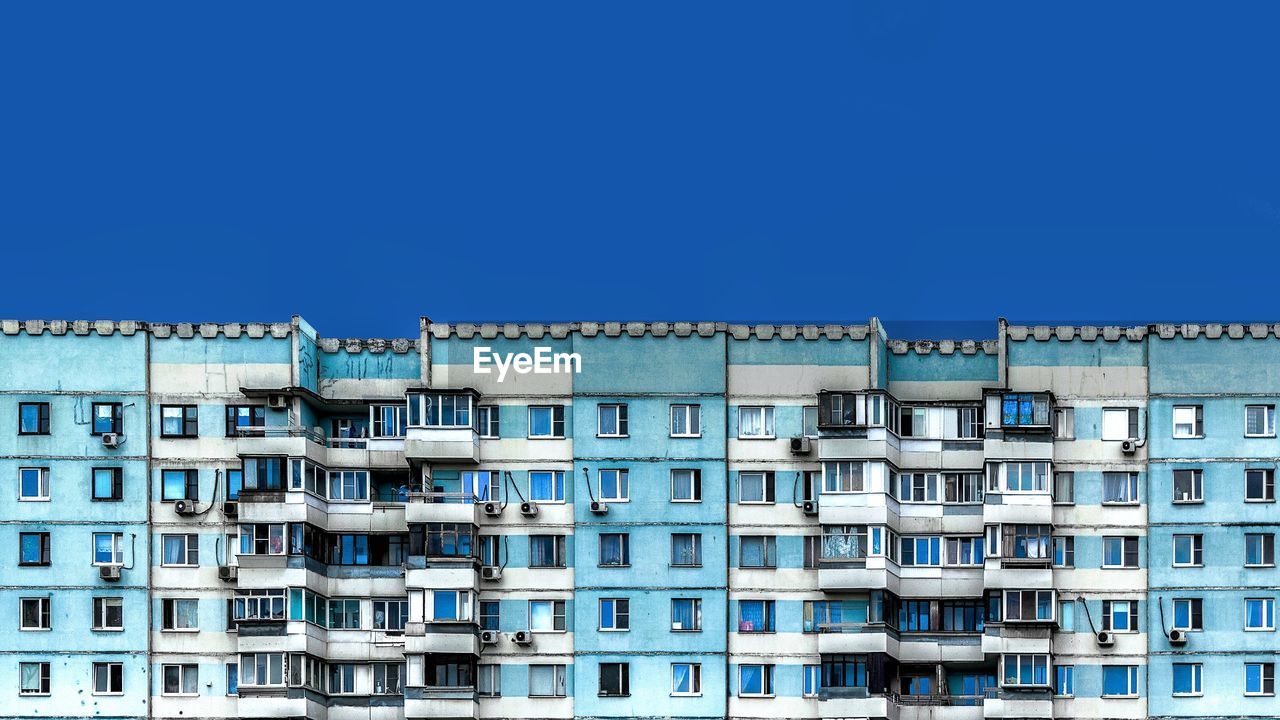 Residential building against blue sky