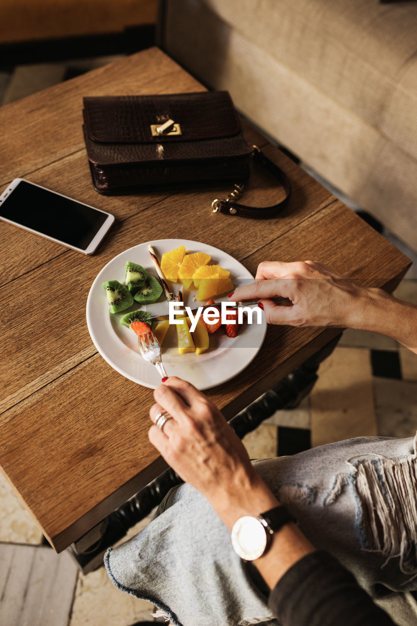 High angle view of man preparing food