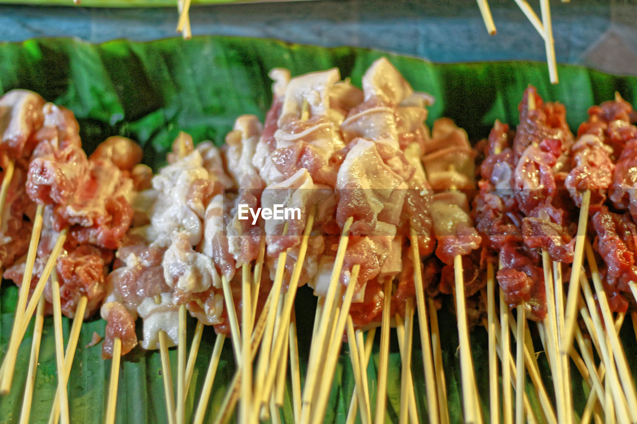 Fresh thai bar-b-q barbecue on banana leaf at street food night market in thailand