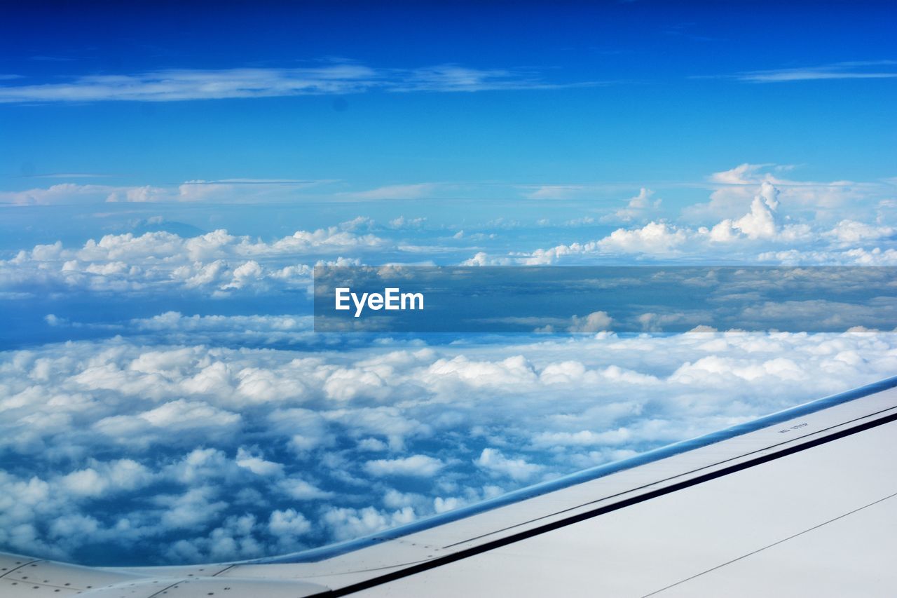 AERIAL VIEW OF CLOUDS OVER BLUE SKY