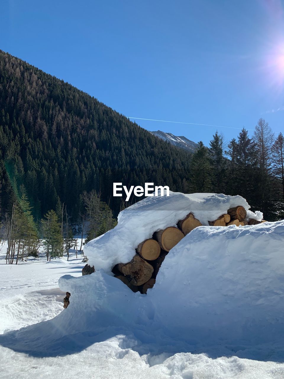 Scenic view of snow covered mountains against sky