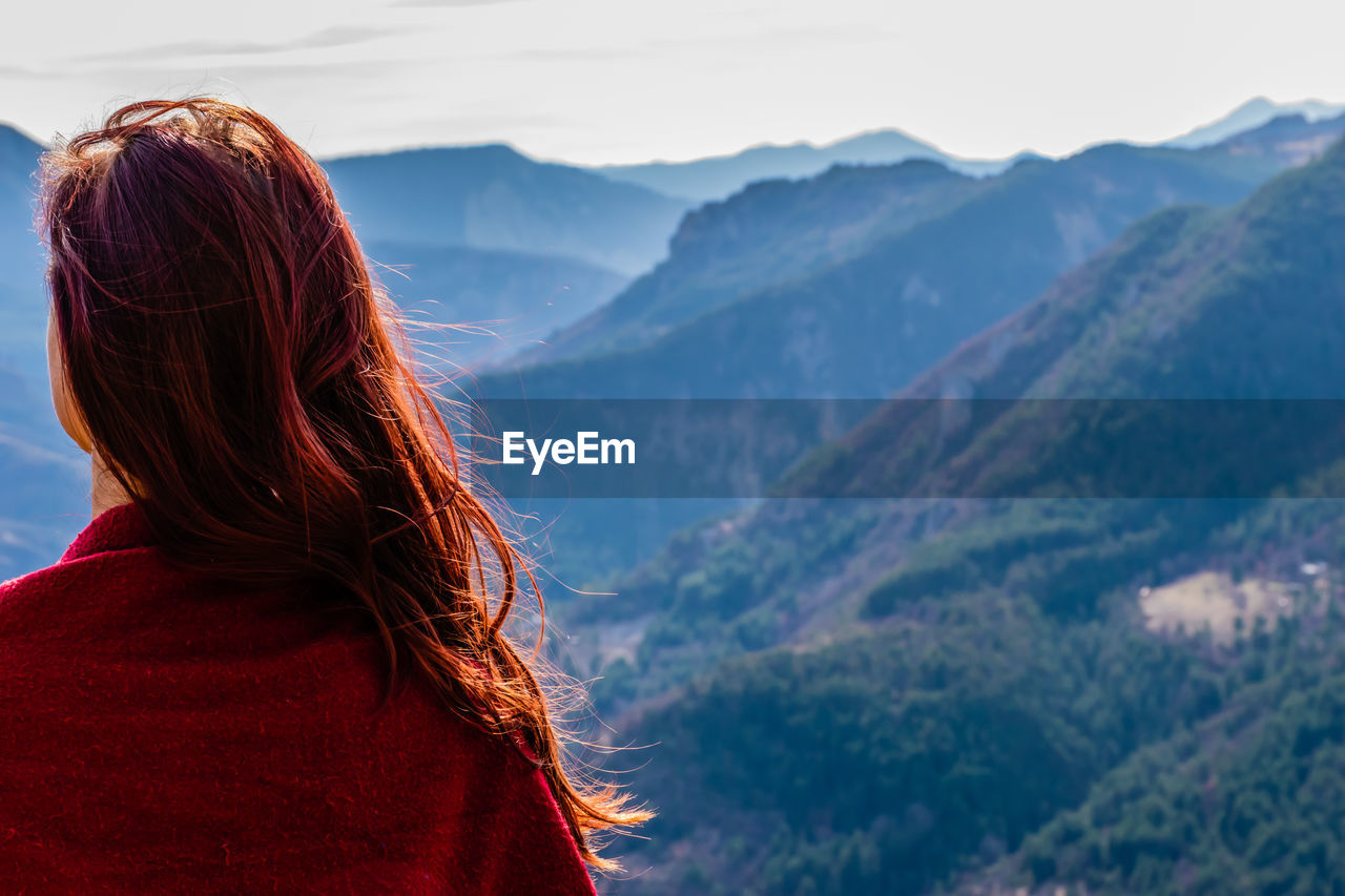 Rear view of woman looking at mountains