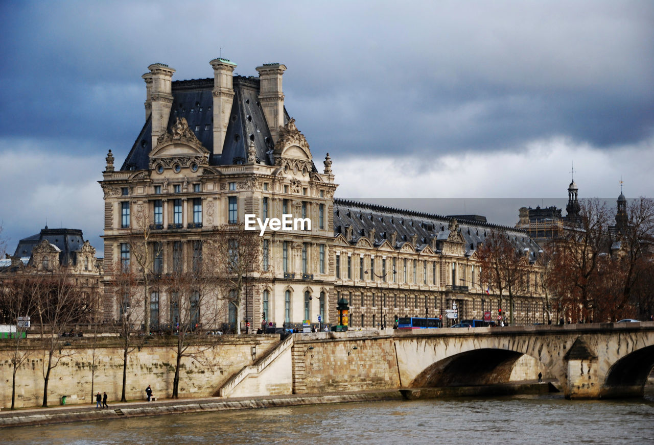 The louvre museum from seine river