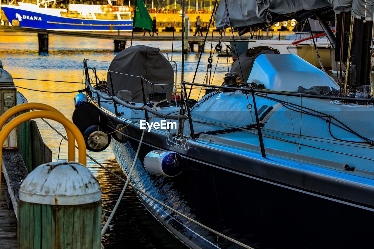 High angle view of boats moored at harbor