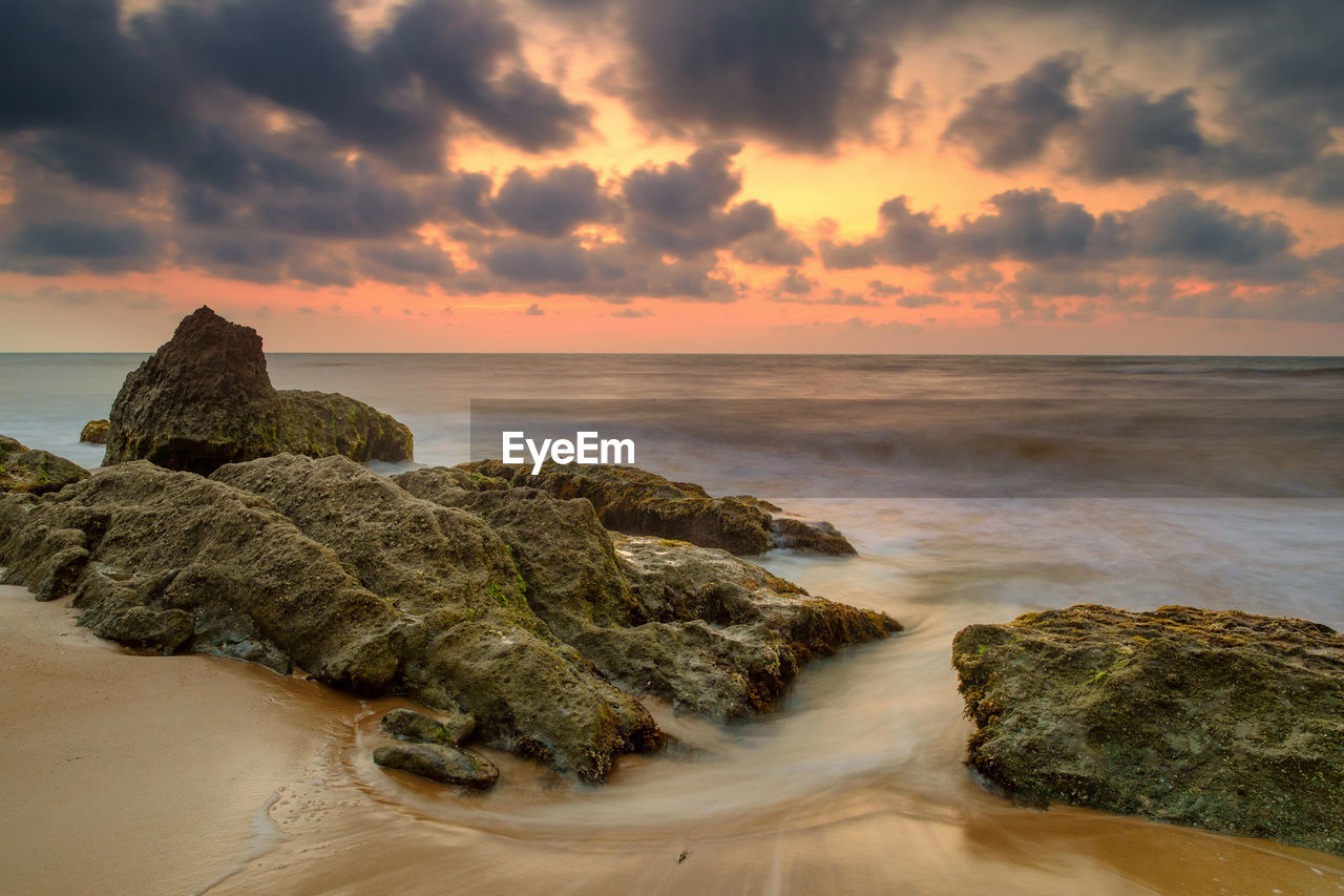 Scenic view of sea against sky at sunset