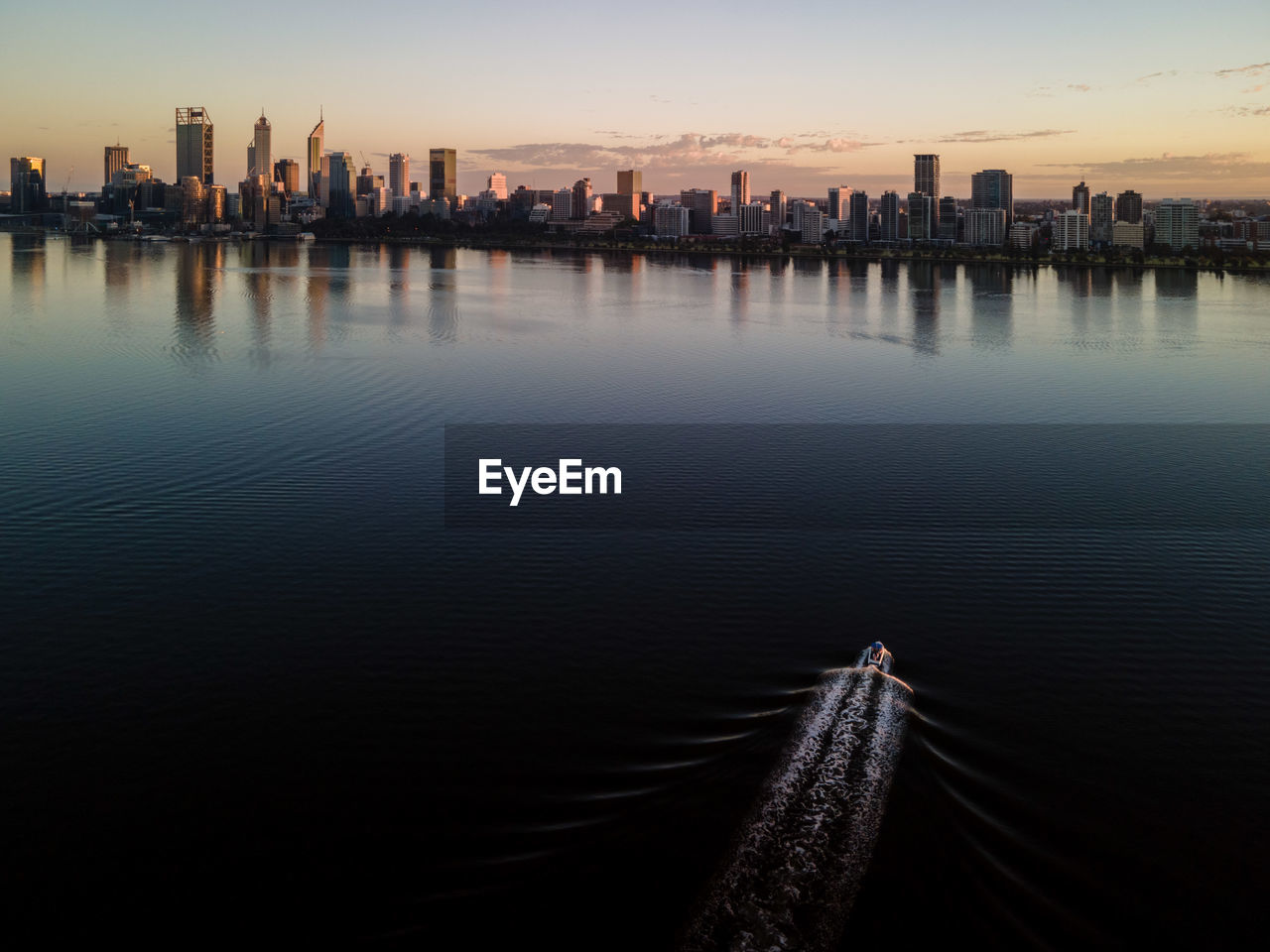 PANORAMIC VIEW OF CITY BUILDINGS DURING SUNSET