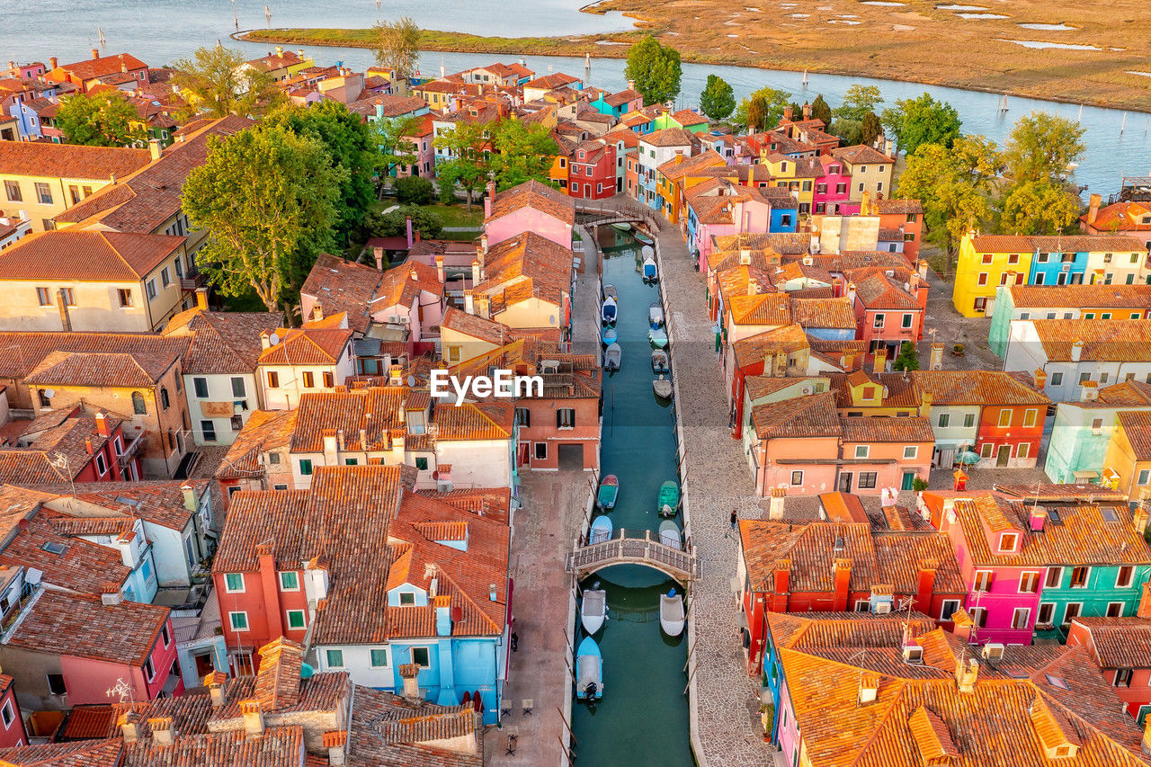 Positive colorful rainbow island of burano. city on water venice. drone type. places worth visiting