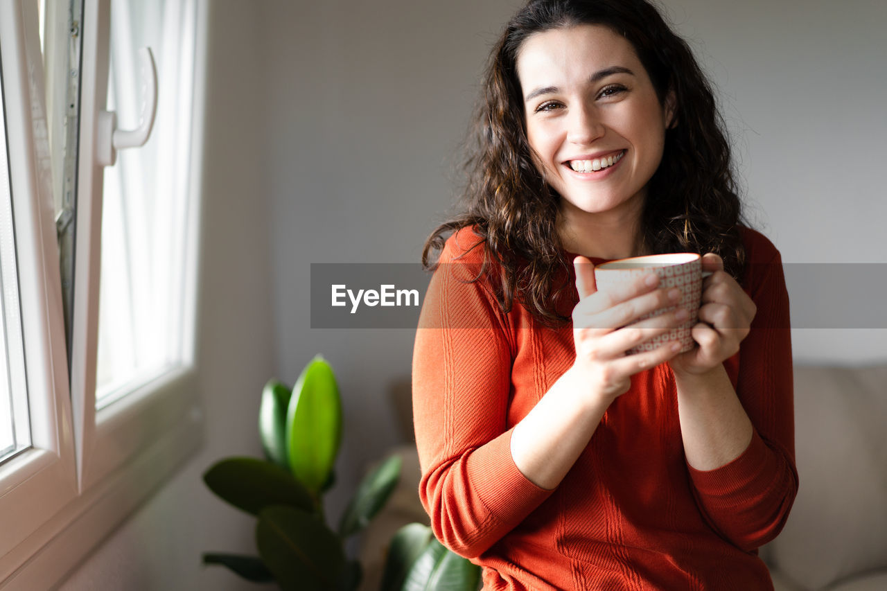 portrait of young woman using mobile phone