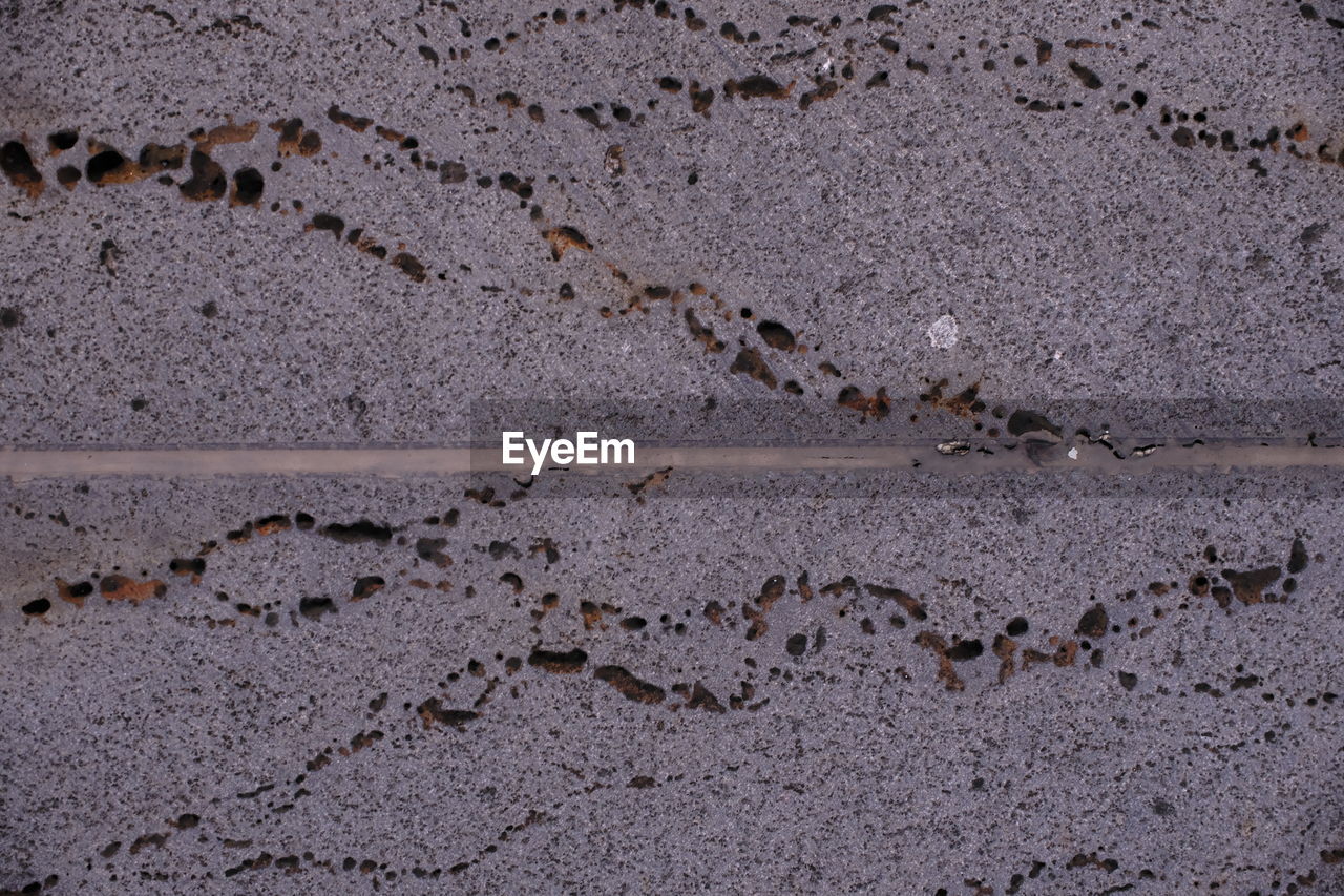 soil, no people, textured, asphalt, road surface, full frame, backgrounds, day, pattern, close-up, rough, wall, wall - building feature, nature, sand, outdoors, cracked, architecture, built structure, concrete, weathered, land, floor, rock, high angle view, old, dirt