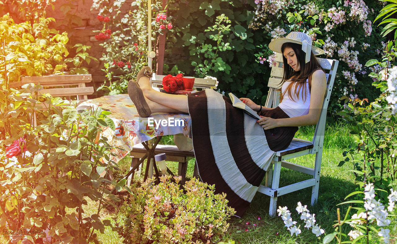 Woman relaxing in garden