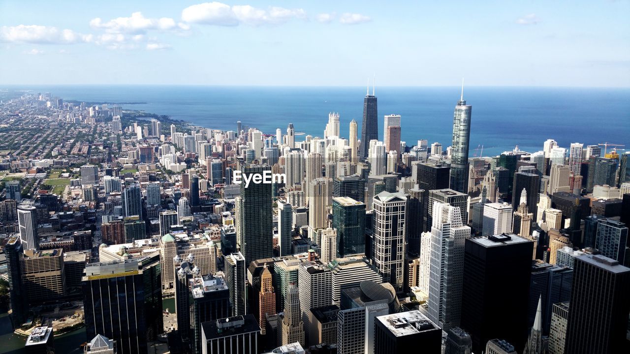 Chicago skyline from willis tower - aerial view of modern buildings in city against sky
