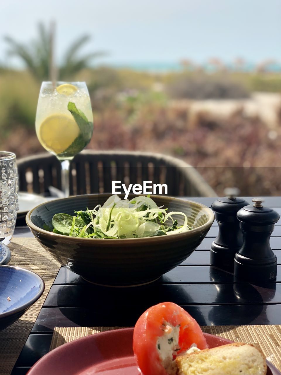 CLOSE-UP OF FRUITS IN GLASS BOWL ON TABLE