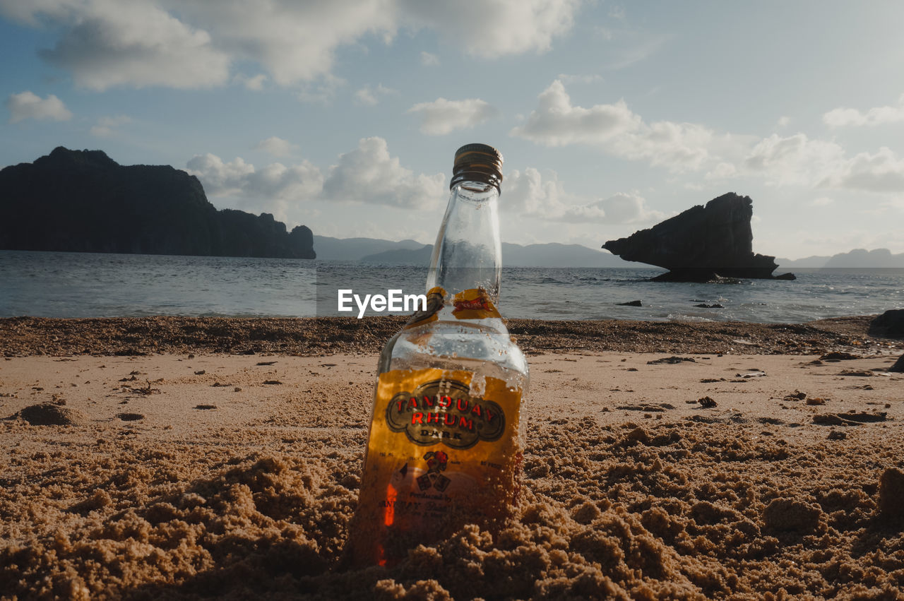 WATER BOTTLE ON BEACH