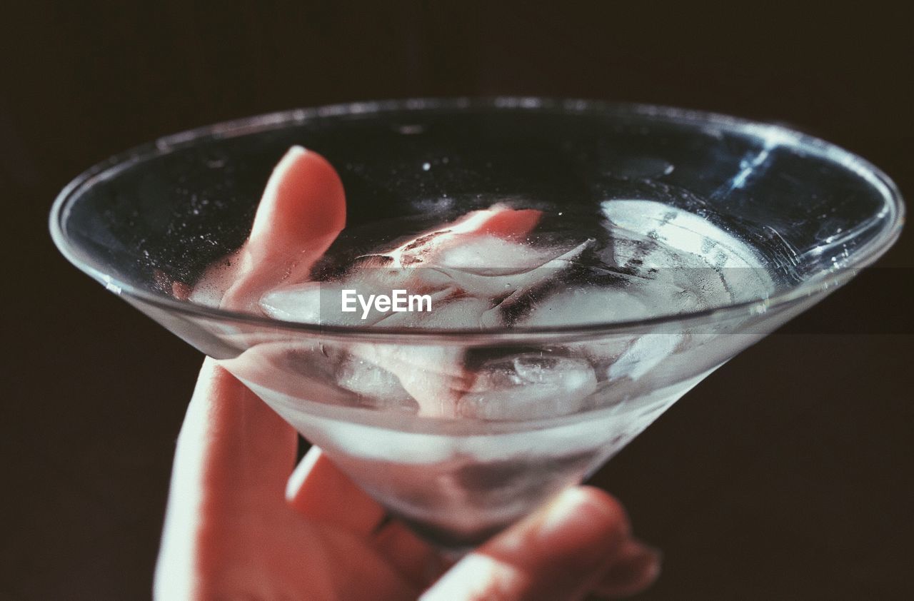 Close-up of hand holding cocktail
