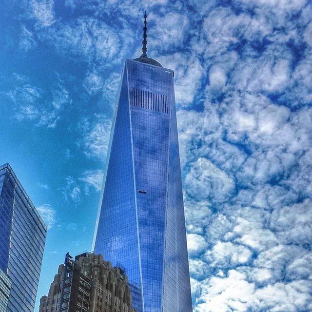 LOW ANGLE VIEW OF TOWER AGAINST CLOUDY SKY