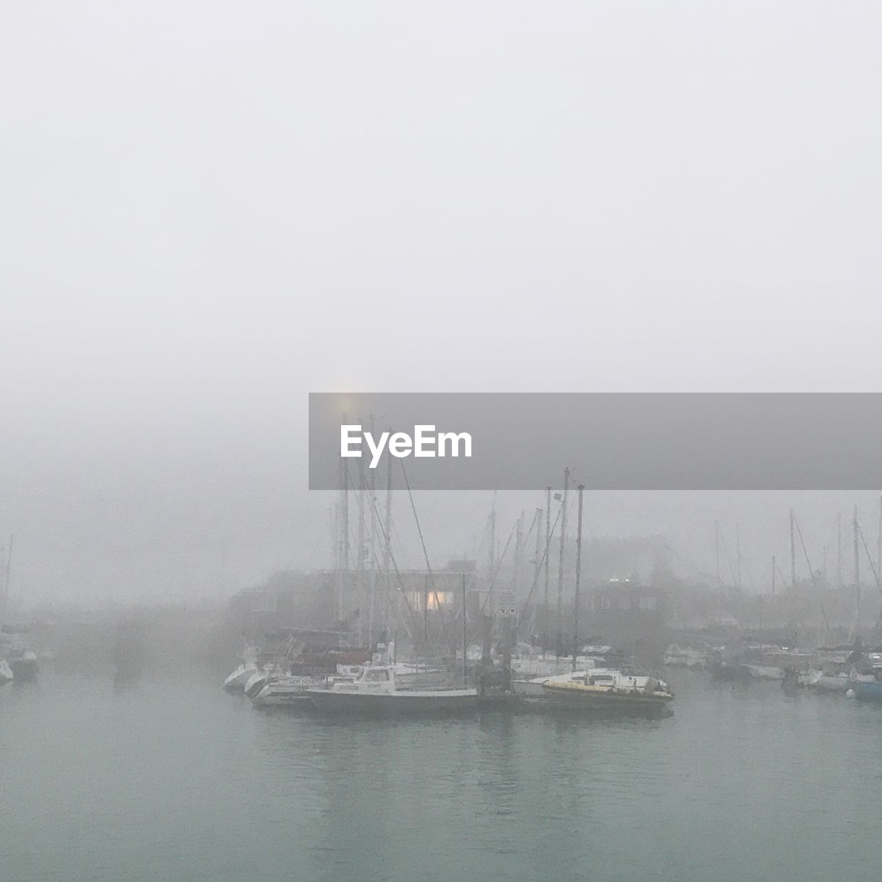 SAILBOATS IN SEA DURING FOGGY WEATHER