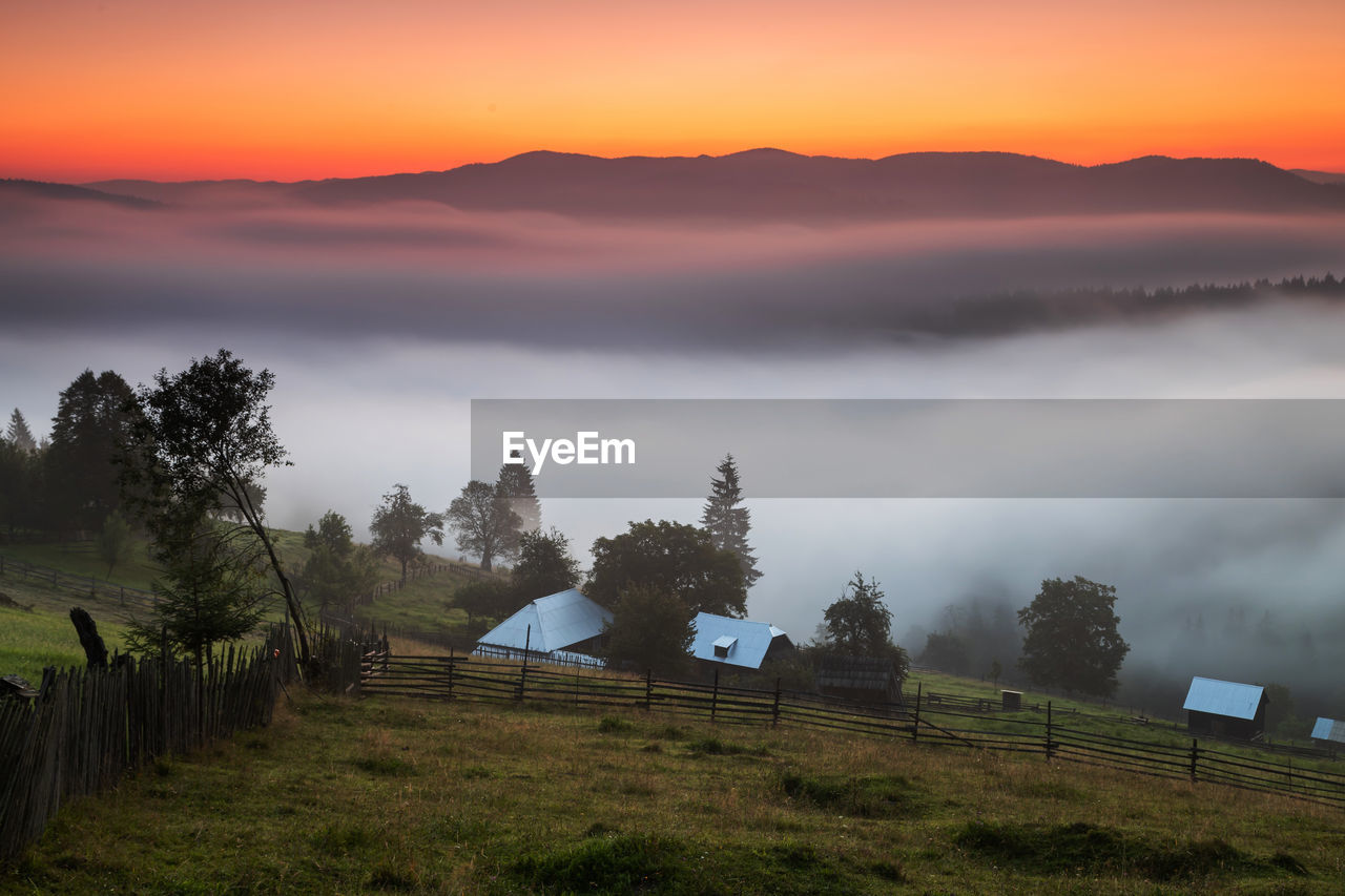 Scenic view of landscape against sky during sunset