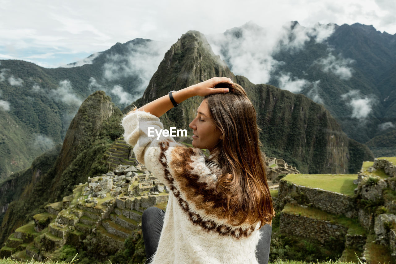 rear view of woman looking at mountains